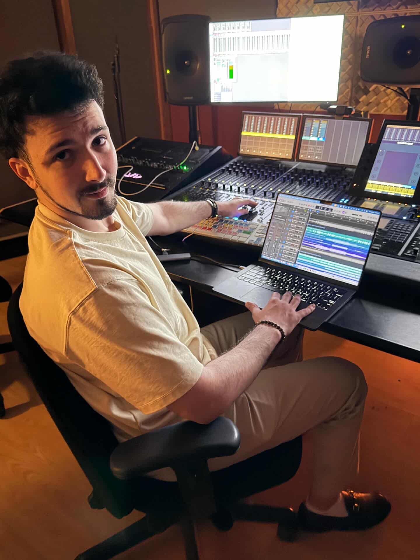 WAVEZ working at a studio mixing desk